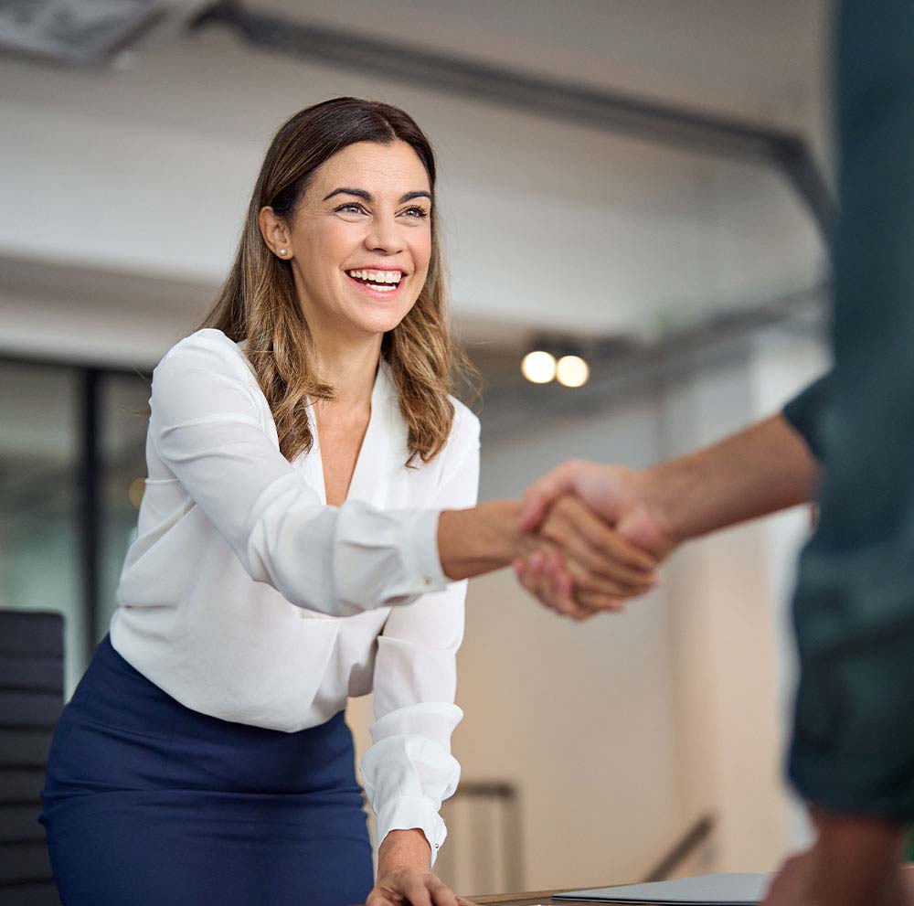 client shaking hands with interviewer
